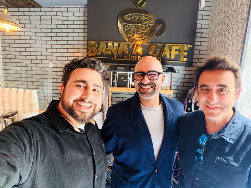 Milad Alucozai and two friends at Sana'a Café