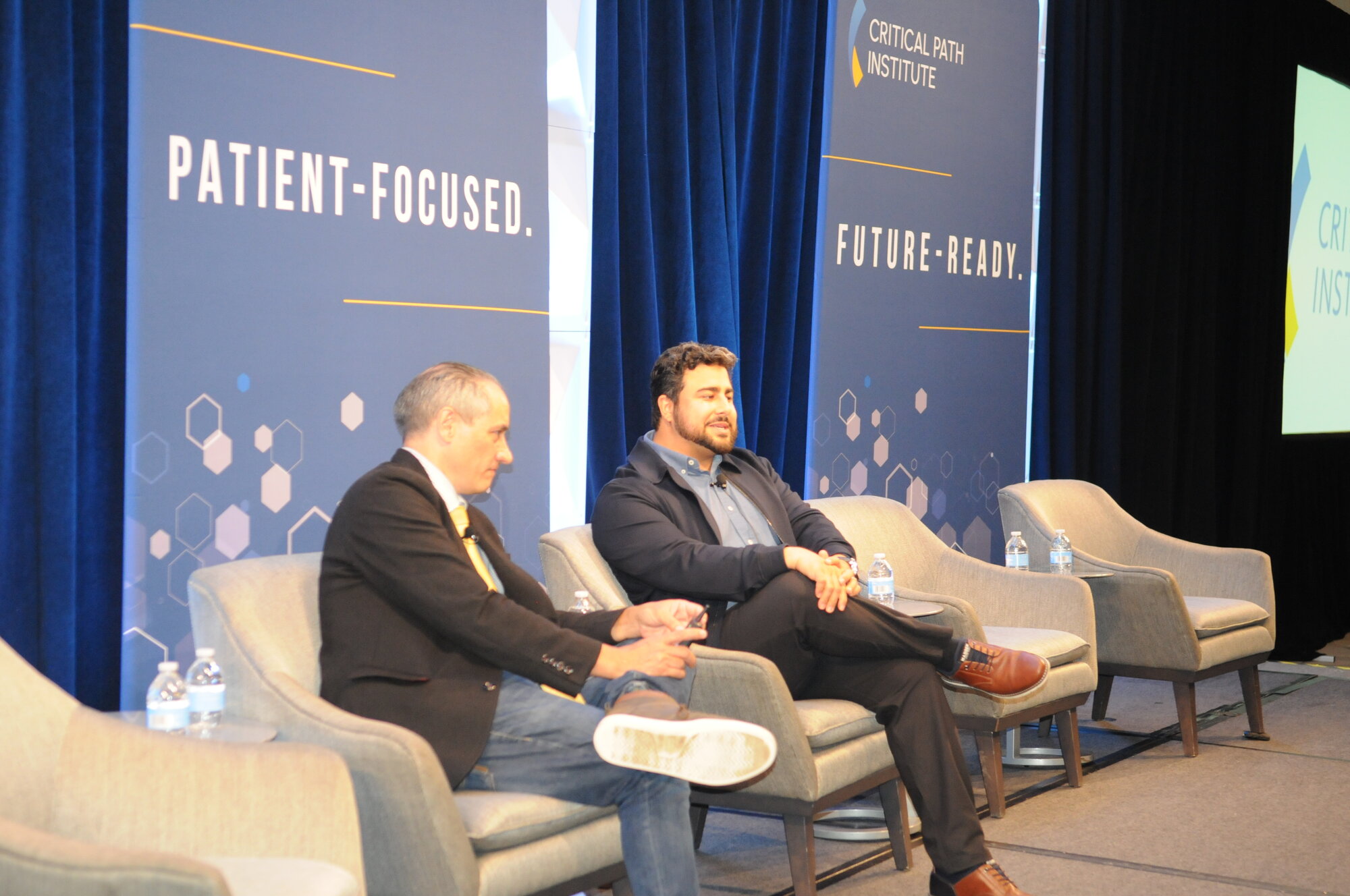 Milad Alucozai in conversation with C-Path CEO Klaus Romero at the 2026 Global Impact Conference